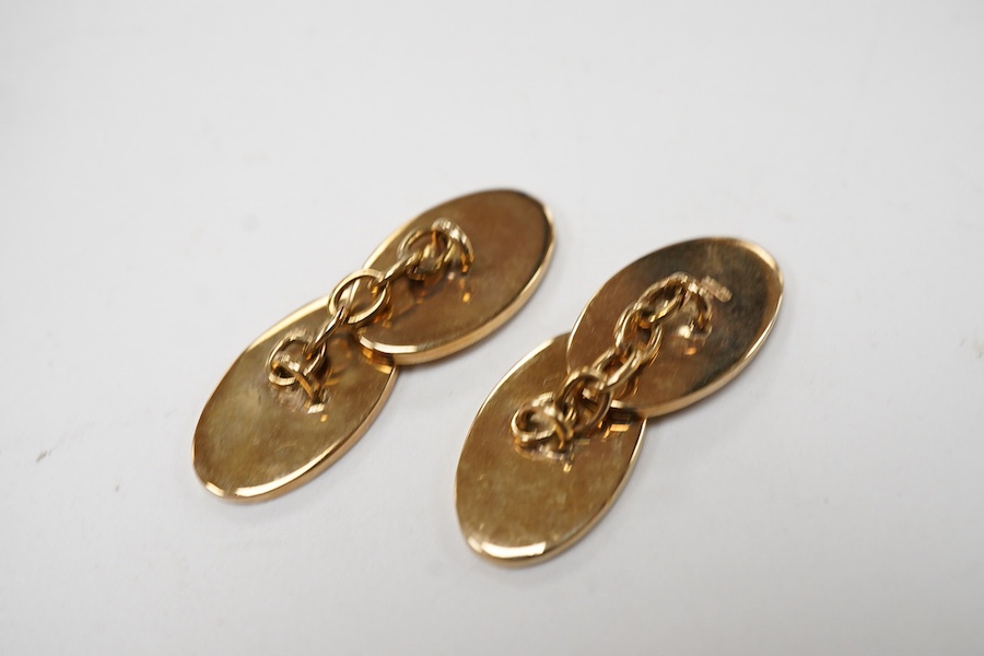 A modern pair of 9ct gold oval cufflinks, engraved with the monogram EC, maker DJ, Birmingham, 1998, 12 grams, with box.